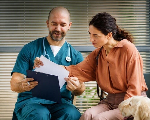 Veterinary professional discussing care options with a pet owner